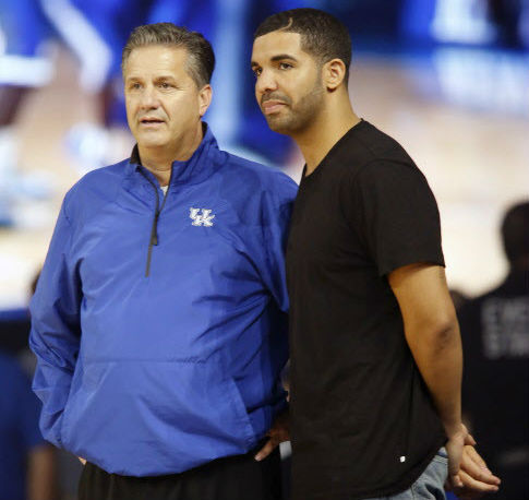 Hip-hop star Drake right watches a Kentucky practice with Wildcats coach John Calipari