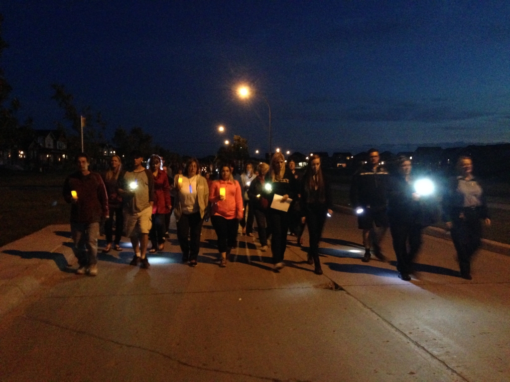 Around 300 people gathered Saturday night for a symbolic walk to light Thelma Krull's way home