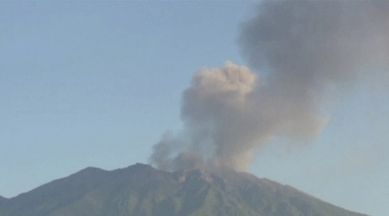 Ash spewing from a volcano on Indonesia's main island of Java has sparked chaos for holiday makers as airports close and international airline