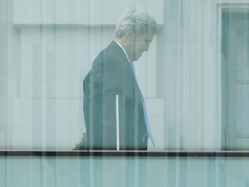 Secretary of State John Kerry walks on the terrace of Palais Coburg the venue for nuclear talks in Vienna Austria on Sunday