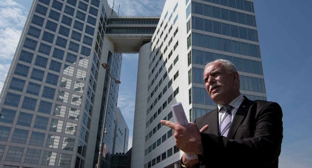 Palestinian Foreign Minister Riyad Al Maliki waits to give an interview outside the International Criminal Court rear in The Hague Netherlands Thursday