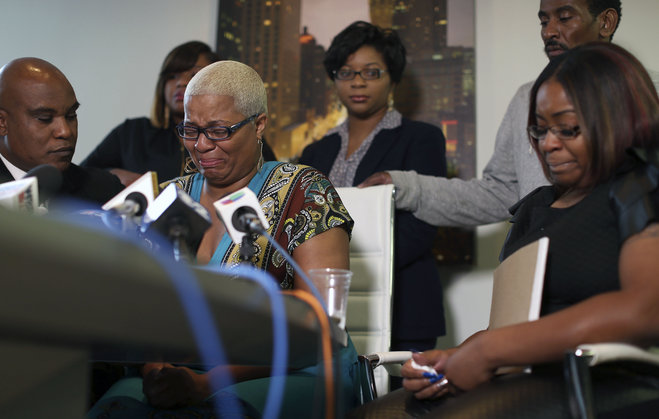 Shavon Bland back left Sharon Cooper back center and Sierra Cole right Sandra Bland's oldest sister Shante Needham center becomes emotional as she tries to answer a question from a reporter during news conference about their sister's death Thurs