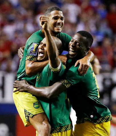 Jamaican players celebrated after Wednesday win over the U.S. in the Gold Cup semifinals. Click