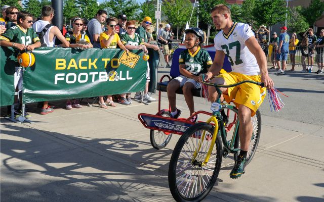 Jordy Nelson biking into camp