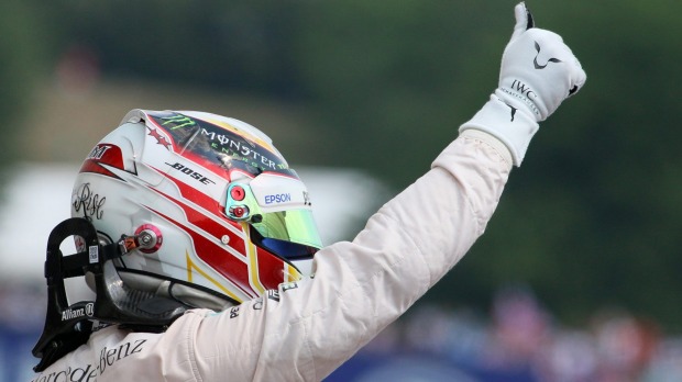 Just like that Mercedes driver Lewis Hamilton celebrates after putting his car on pole