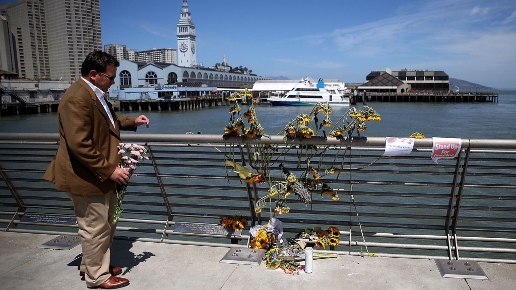 Justin Sullivan  Getty Images
A well-wisher drops off flowers at the site where 32-year-old Kathryn Steinle was killed