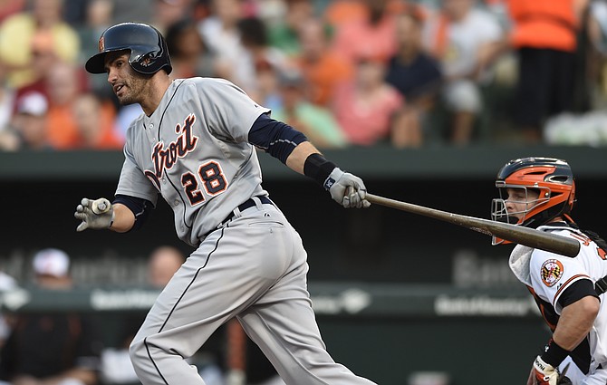 Detroit Tigers&#39 J.D. Martinez follows through on a two run double against the Baltimore Orioles in the first inning Thursday in Baltimore