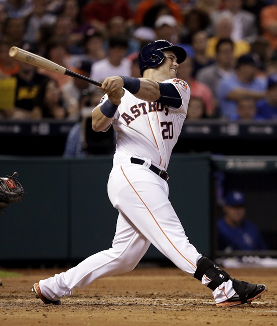 Houston Astros Preston Tucker swings for an RBI single against the Kansas City Royals in the third inning of a baseball game Monday