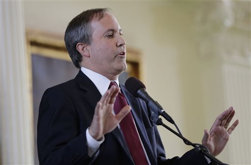 FILE- In this Jan. 5 2015 file photio Ken Paxton speaks after he was sworn in as Texas attorney general in Austin Texas. Paxton calls the Supreme Court decision giving same-sex couples the right to marry a'lawless ruling and says state workers can