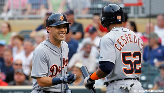 Detroit Tigers&#039 Ian Kinsler left is congratulated by Yoenis Cespedes after Kinsler's solo home run off Minnesota Twins starting pitcher Mike Pelfrey during the first inning of a baseball game in Minneapolis Thursday