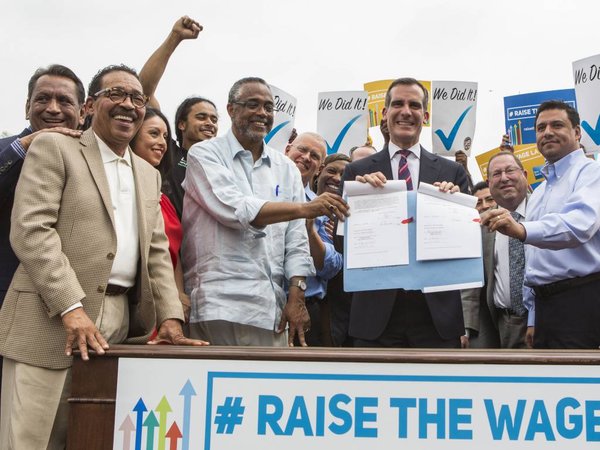 Los Angeles Mayor Eric Garcetti center right joins members of the City Council and community leaders in