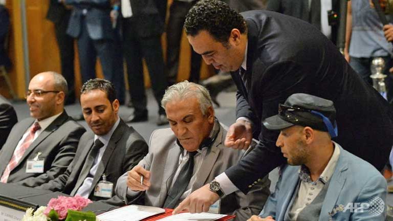 Libyan rivals sign peace deal as Islamist government in Tripoli stays away