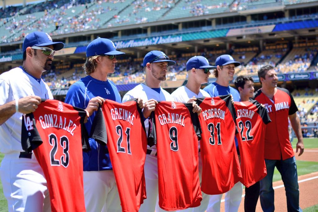 1B Adrian Gonzalez RHP Zack Greinke C Yasmani Grandal CF Joc Pederson and LHP Clayton Kershaw are presented with their National League All Star jerseys prior to Sunday's game against the Milwaukee Brewers at Dodger Stadium. (Mandatory Credit Los Ange