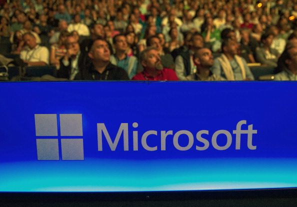 Attendees watch a video presentation during the Microsoft Worldwide Partner Conference 2014 at the Verizon Center in Washington DC