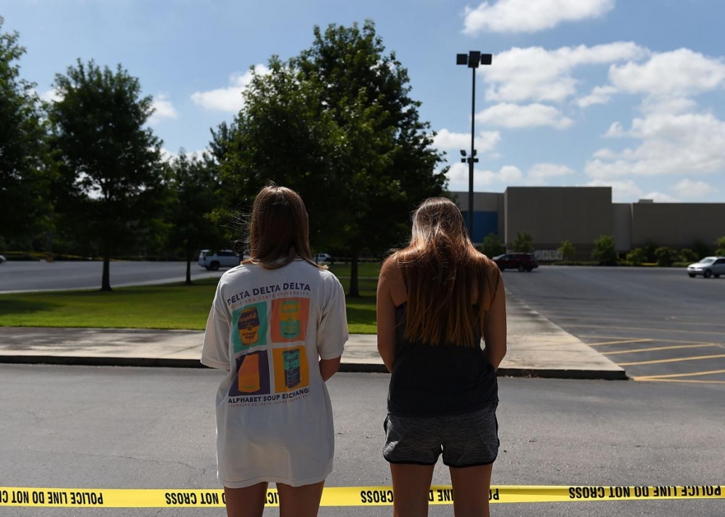 481792024-mourners-stand-outside-of-the-grand-theatre-on-july-24