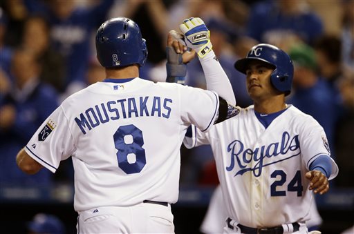 Kansas City Royals&#039 Mike Moustakas is congratulated by teammate Christian Colon after his two-run home run in the fifth inning of a baseball game against the Minnesota Twins at Kauffman Stadium in Kansas City Mo. Tuesday