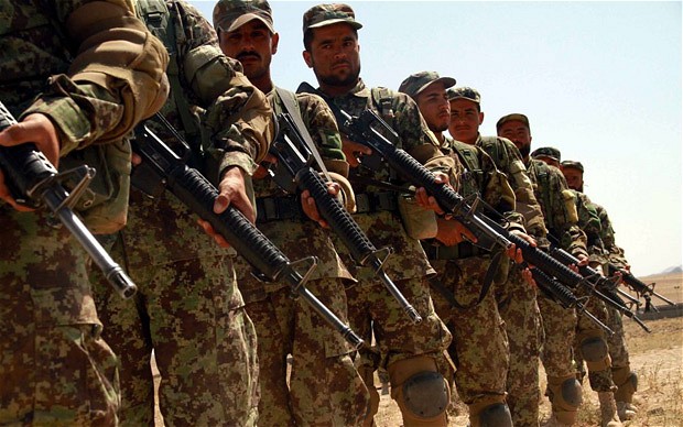 Afghan soldiers perform during their training by the US Army in Herat city one of the seven Afghan cities and provinces where US is to handover security responsibility to Afghan forces