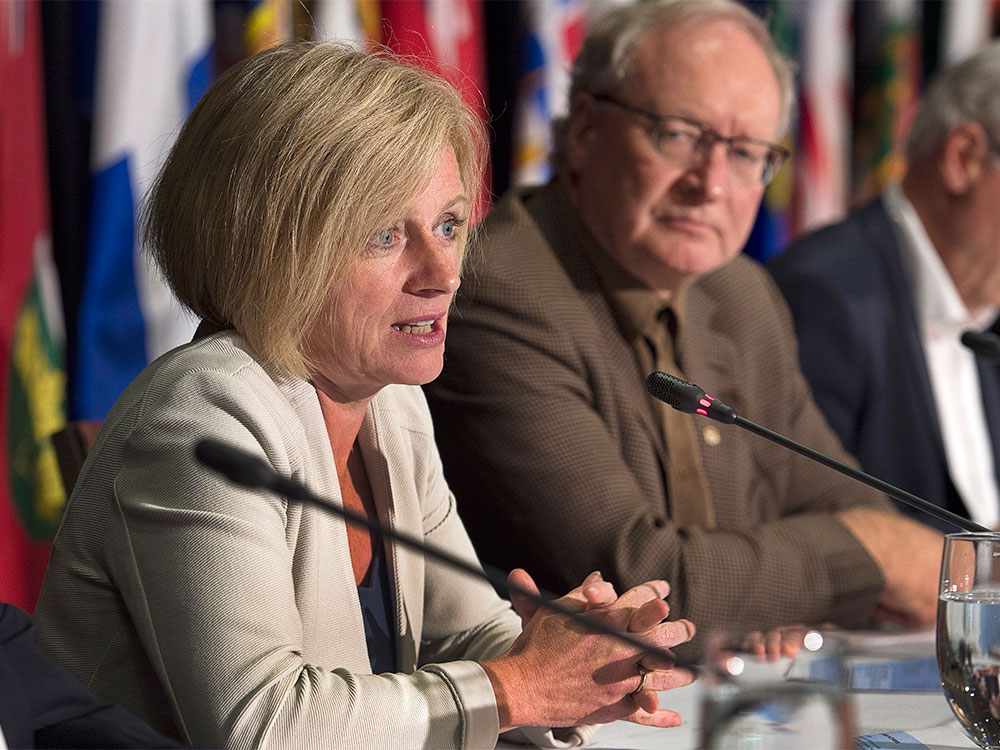 Alberta Premier Rachel Notley left answers a question as Prince Edward Island Premier Wade Mac Lauchlan looks on at the closing news conference of the summer meeting of Canada's premiers in St. John's on Friday July 17