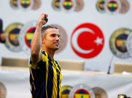 Netherlands striker Robin van Persie greets supporters during his contract-signing ceremony with Turkish club Fenerbahce at Sukru Saracoglu Stadium in Istanbul Turkey