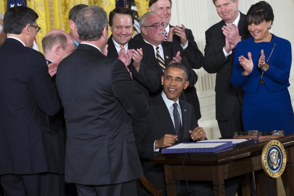 President Barack Obama smiles after signing ceremony for H.R. 2146 Defending Public Safety Employees Retirement Act and H.R. 1295 Trade Preferences Extension Act of 2015 on Monday in the East Room of the White House in Washington D.C. (Evan Vucci  The Ass