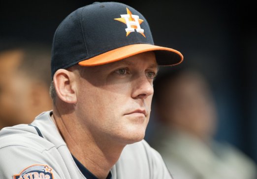 ST. PETERSBURG FL- JULY 11 A.J. Hinch #14 Manager of the Houston Astros looks on from the dugout in the first inning against the Tampa Bay Rays