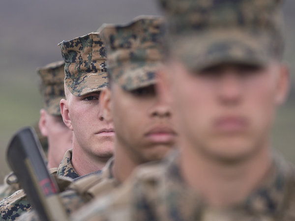 US army soldiers stand in formation during a joint military training. The army plans to cut 40,000 soldiers from its ranks and 17,000 civilian employees from its payroll by 2017