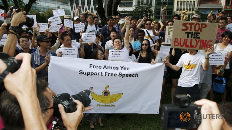 Organiser Jolovan Wham and participants shout slogans during a protest to free blogger Amos Yee at Hong Lim Park on Jul 5 2015