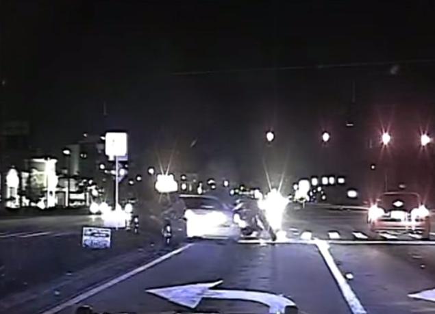 Orlando Police Officer William Anderson continues to fire at the vehicle after getting hit in dashcam video