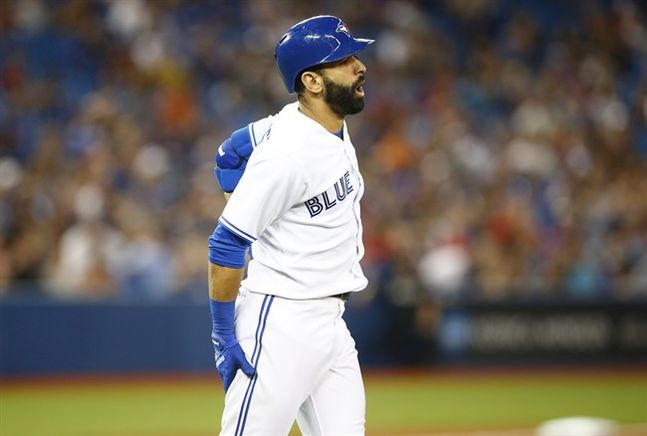 Toronto Blue Jays Jose Bautista holds his leg after his at bat against the Philadelphia Phillies during the eighth inning of MLB interleague baseball action in Toronto Tuesday