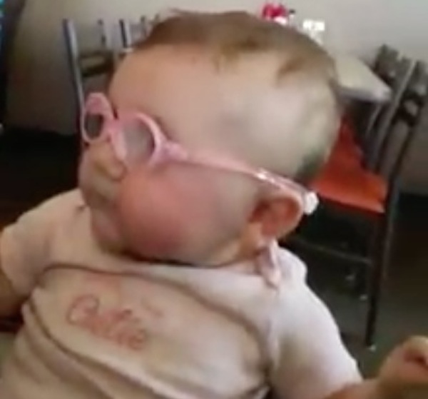 Piper takes a good look through her new glasses for the first time