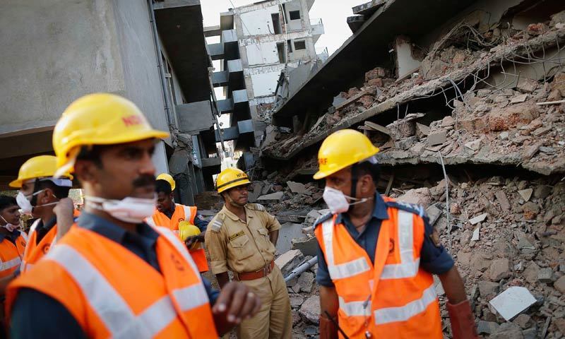 Police fear that still some six people are trapped under the debris of the building.—Reuters  File