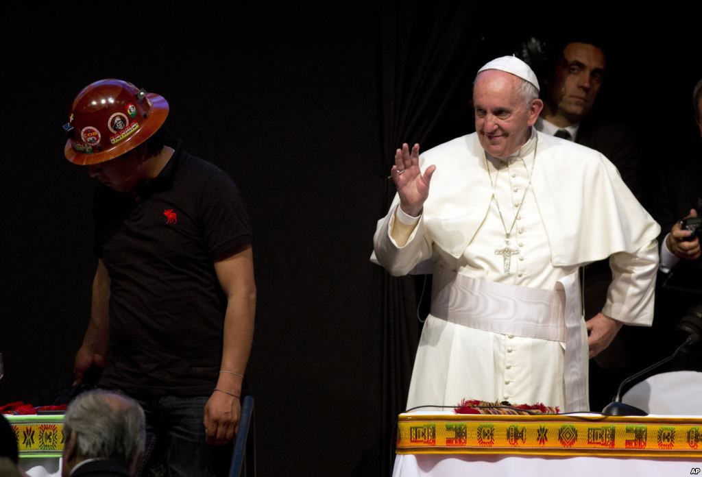 Pope Francis waves during the second Global Meeting of Popular Movements in Santa Cruz Bolivia Thursday