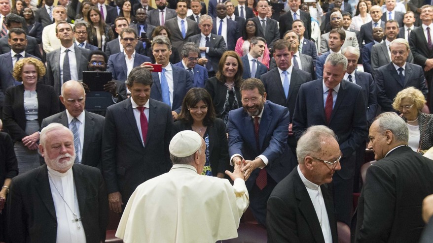 Pope Francis greets mayors in the Synod Hall