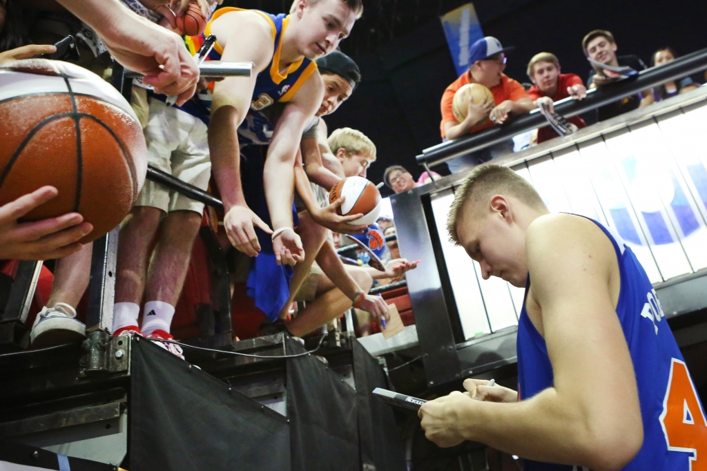 Porzingis signs autographs after a Summer League