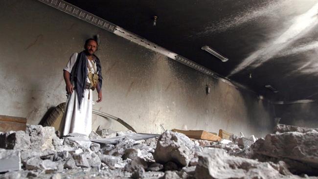 A Yemeni man stands amid the debris of a house destroyed in an airstrike by Saudi Arabia in the capital Sana’a