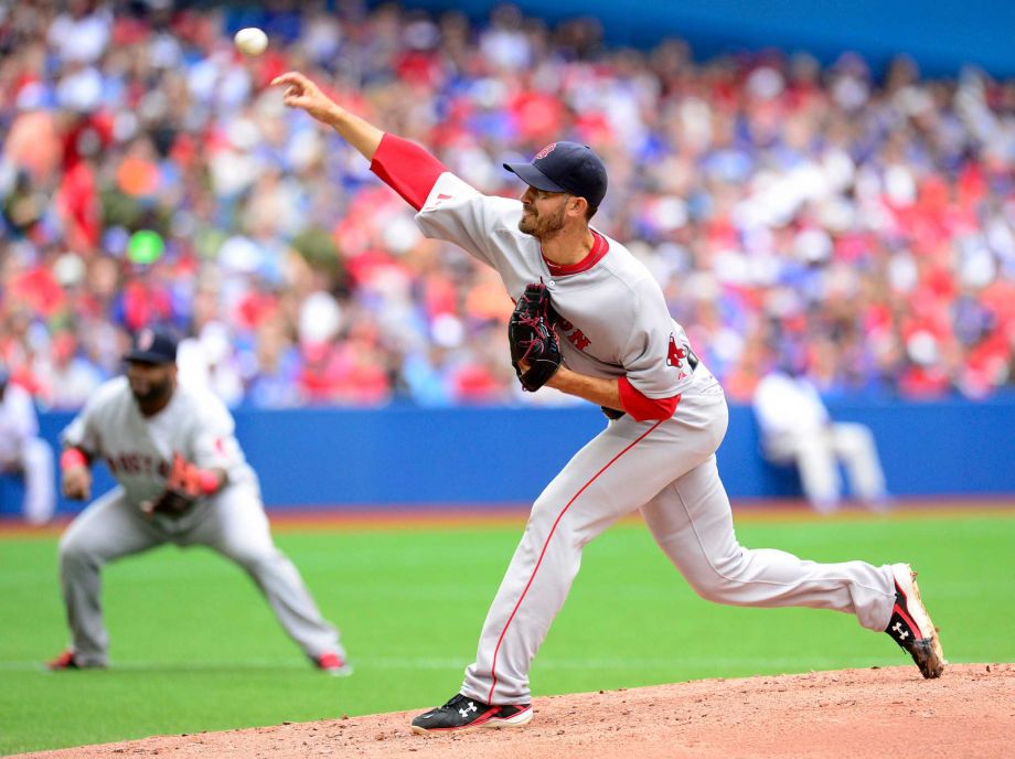 Boston Red Sox starter Rick Porcello delivers to the Toronto Blue Jays during a baseball game in Toronto on Wednesday