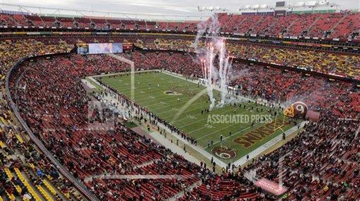 A sparse crowd watches pregame ceremonies at Fed Ex Field before a game between the Washington Redskins and the Tampa Bay Buccaneers