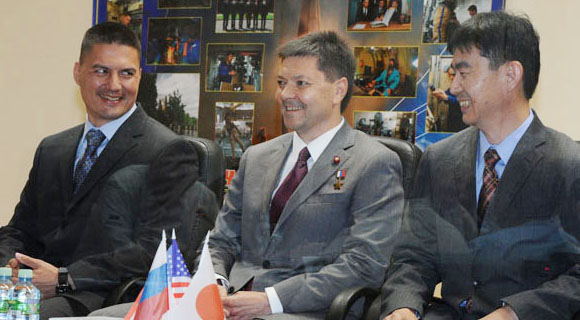 FROM LEFT TO RIGHT Expedition 44 crew members Kjell Lindgren Oleg Kononenko and Kimiya Yui announce their mission readiness at the State Commission at the Baikonur Cosmodrome in Kazakhstan