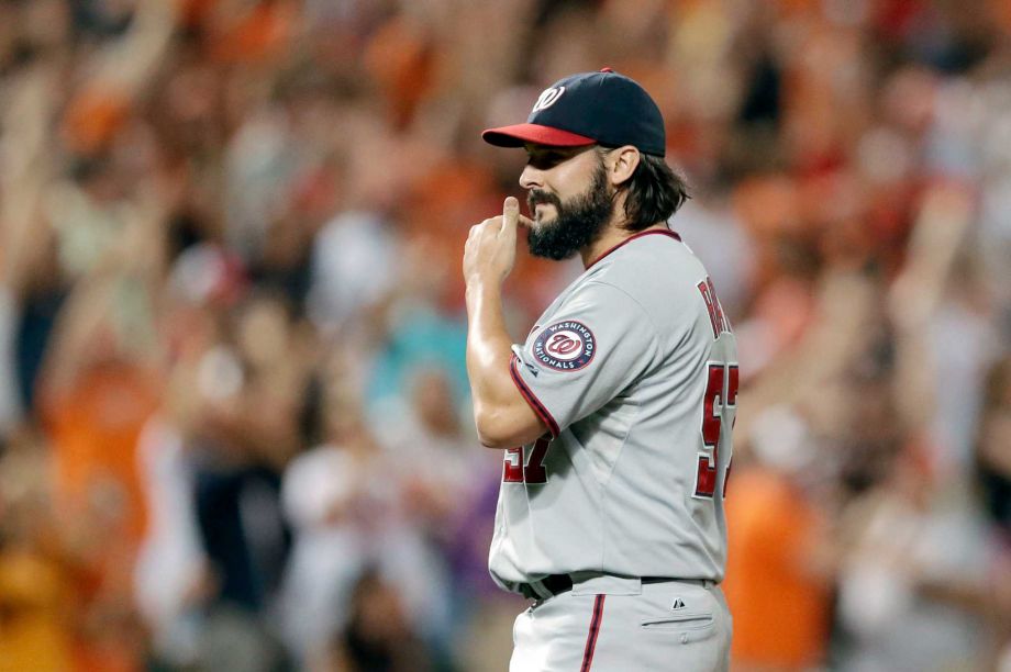 Washington Nationals relief pitcher Tanner Roark walks off the field after giving up a solo home run to Baltimore Orioles Jonathan Schoop in the ninth inning of an interleague baseball game Friday