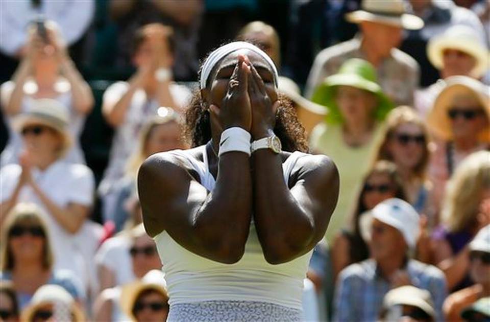 Serena Williams of the United States celebrates winning the singles match Garbine Muguruza of Spain after the women's singles final at the All England Lawn Tennis Championships in Wimbledon London Saturday