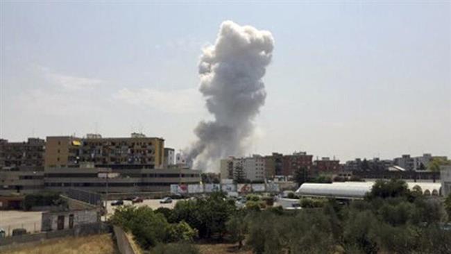 A plume of smoke rises after an explosion at the Bruscella fireworks factory in Modugno Italy