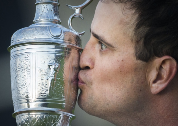 USA's Zach Johnson kisses the Claret Jug after winning The Open Championship