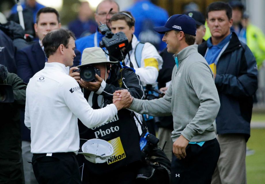 United States’ Zach Johnson left is congratulated by United States’ Jordan Spieth after winning a playoff after the final round of the British Open Golf Championship at the Old Course St. Andrews Scotland Monday