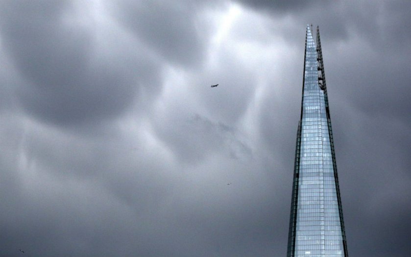 The shard with plane flying over head