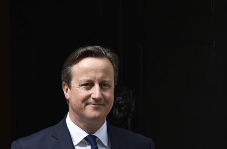 Britain's Prime Minister David Cameron waits to greet his Ukrainian counterpart Arseniy Yatsenyuk at Number 10 Downing Street in London Britain