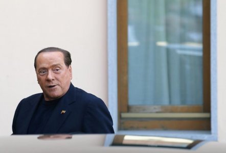 Former Italian Prime Minister Silvio Berlusconi looks on as he arrives at the Sacred Family Foundation where he will serve part of his one-year tax fraud sentence by doing community service with the elderly in Cesano Boscone a small town on the outskir