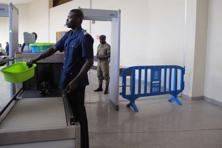 Security personnel scan people's belongings before entering the court building where the trial of former Chadian dictator Hissene Habre is taking place in Dakar Senegal Monday