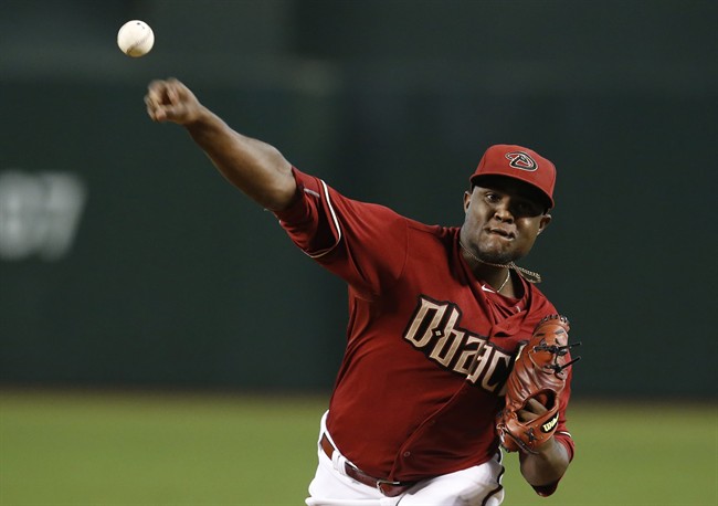 Arizona Diamondbacks starting pitcher Rubby De La Rosa throws in the first inning during a baseball game against the Colorado Rockies Sunday