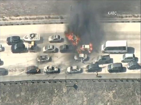 A brush fire ignited cars on Interstate 15