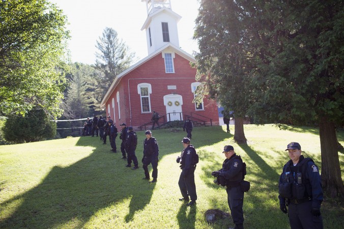 Law enforcement personnel prepare to head out on a search for convicted murderers Richard Matt and David Sweat continues